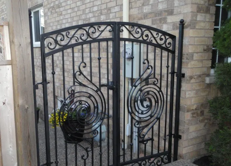 Double iron gate with scrollwork