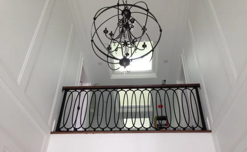 Interior iron railing on a staircase landing